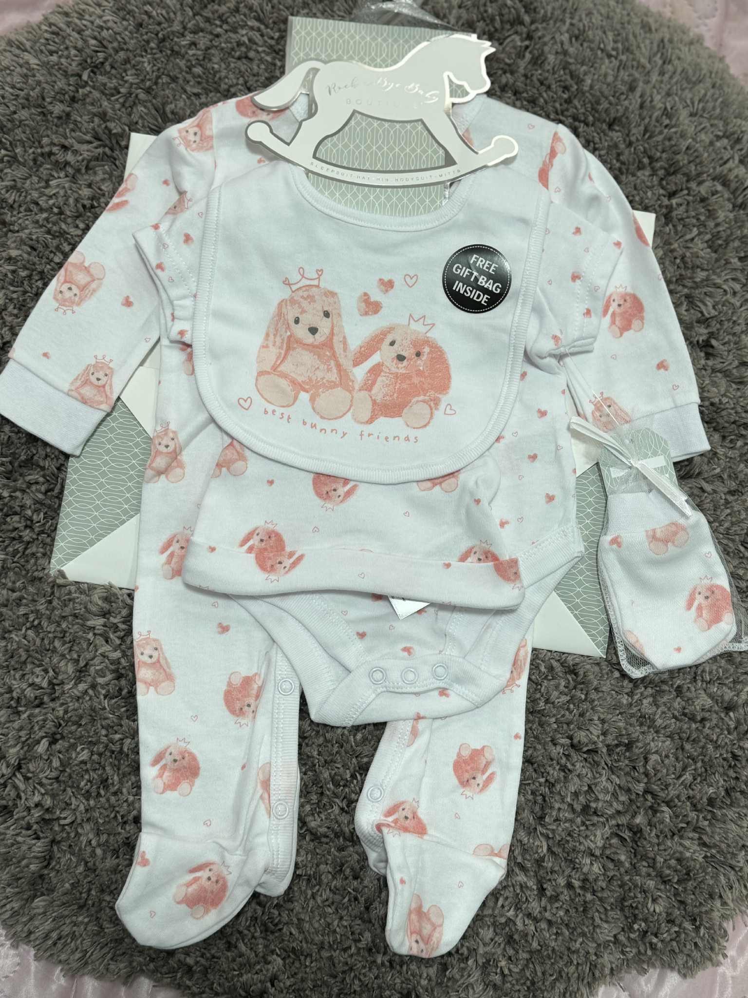Adorable Baby Girls 5 Piece Layette gift set in Pink &amp; White with bunny prints. Set consists of sleepsuit, bodysuit, hat, bib and mittens and Giftbag. Made of 100% Cotton.