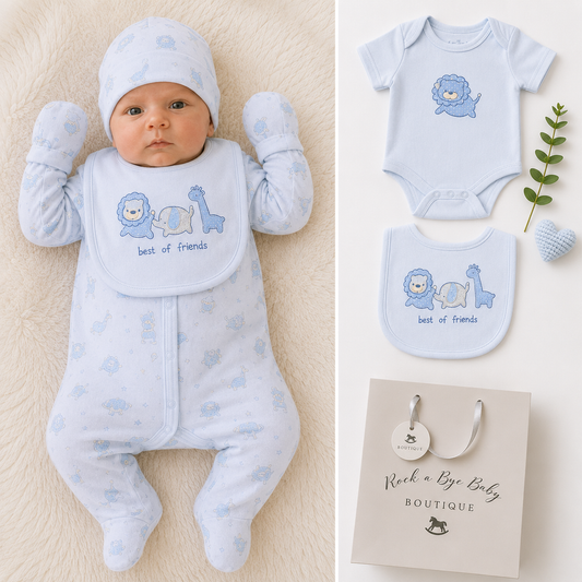 A baby wearing a light blue footed sleeper, matching bonnet, and bib with a lion and giraffe graphic and the words 'best of friends.' The left side shows the baby lying on a cream textured surface, and the right side shows the matching outfit pieces plus a gift bag from Rock a Lye Baby Boutique.
