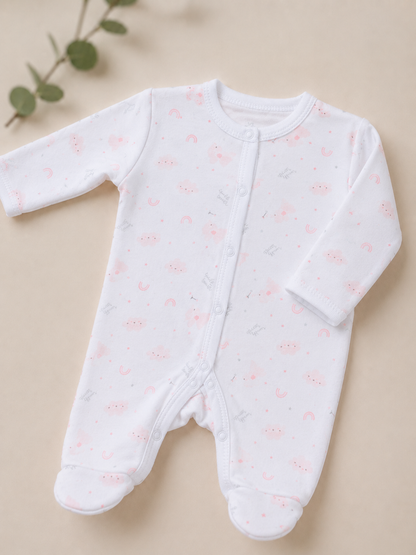 Baby onesie with pink floral pattern on a beige background