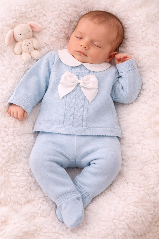  Beautiful Spanish-style knitted baby outfit in blue with white Peter Pan collar and bow detail. Perfect for special occasions. Available in 0-3 months.
