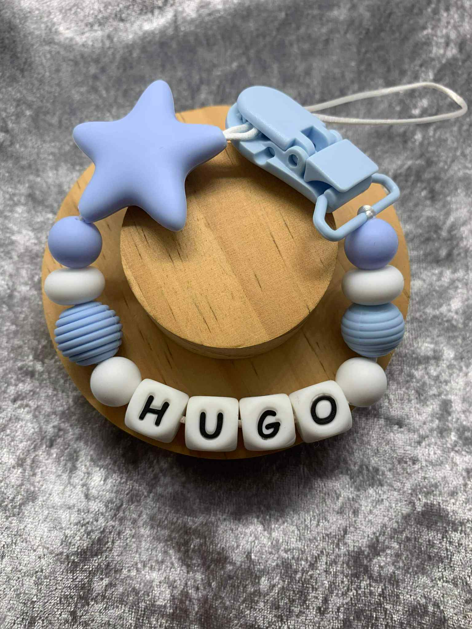 A dummy clip in blue and white colors, personalized with any name 