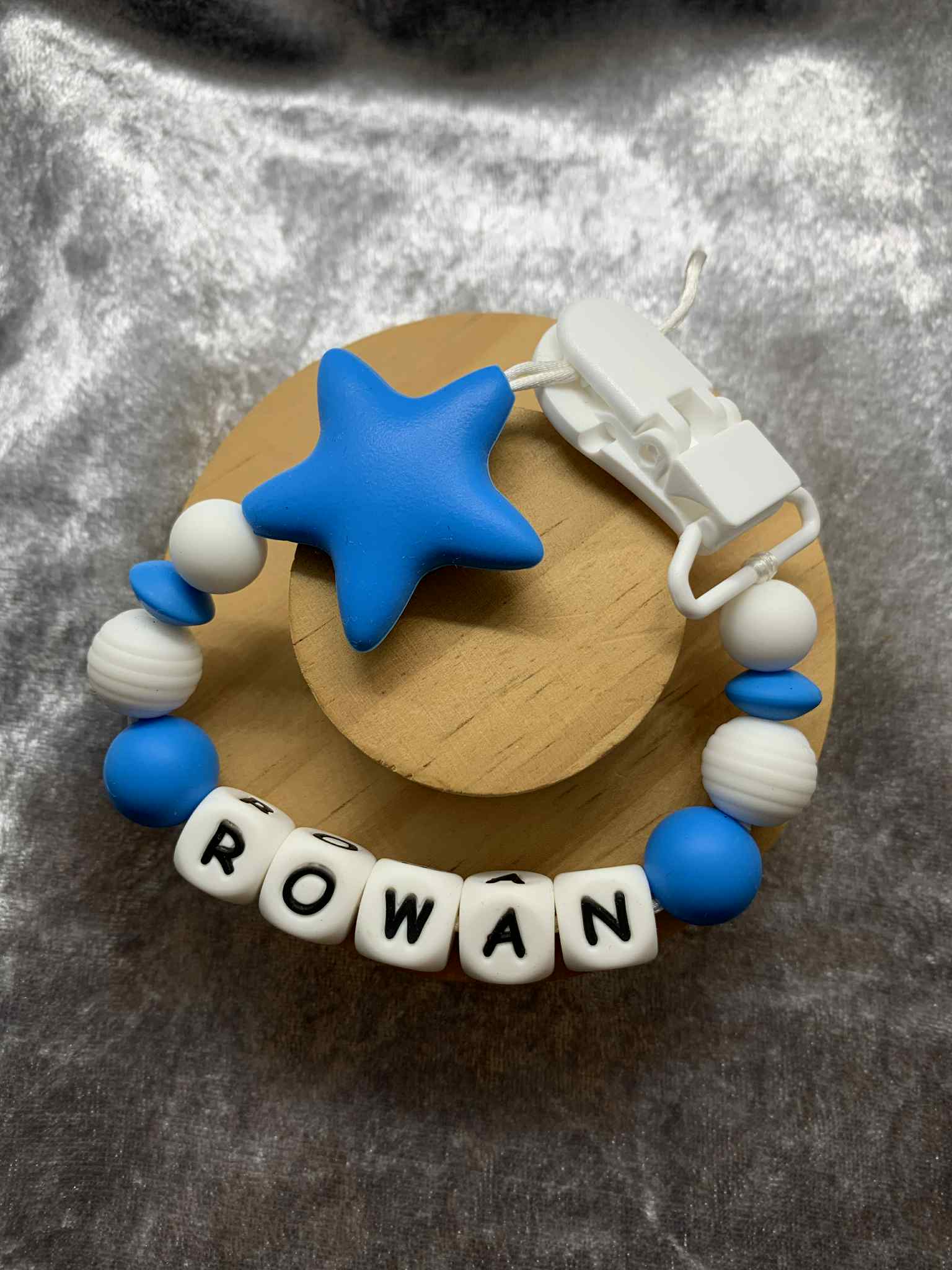 A dummy clip in blue and white colors, personalized with any name 
