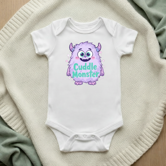 Cuddle Monster baby bodysuit mockup flat lay on cream knit blanket