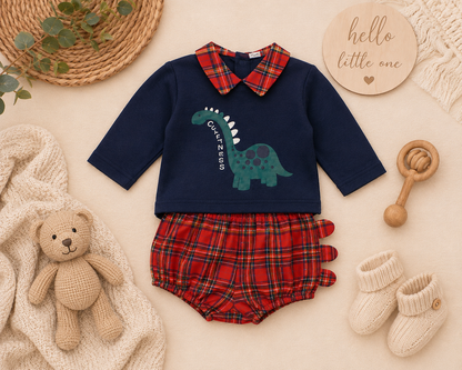 Cuteness dinosaur Spanish 2-piece tartan set flatlay showing navy top with dinosaur print and red tartan bloomer shorts