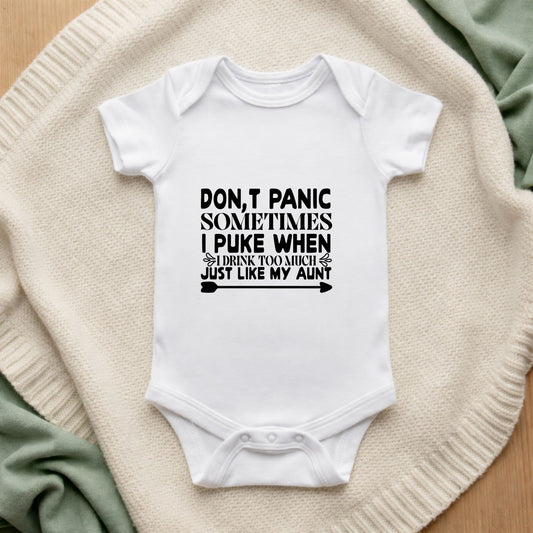 White baby onesie with humorous text on a textured surface Don't Panic Sometimes I Puke When I Drink Too Much Just Like My Aunt Baby Vest