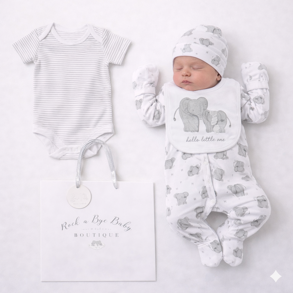 Baby outfit set with onesie, hat, and bib on a white background