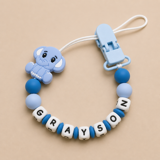 Blue elephant-shaped teether with letter beads on a beige background