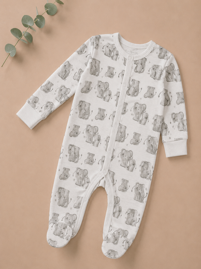 Baby onesie with bear pattern on a beige background