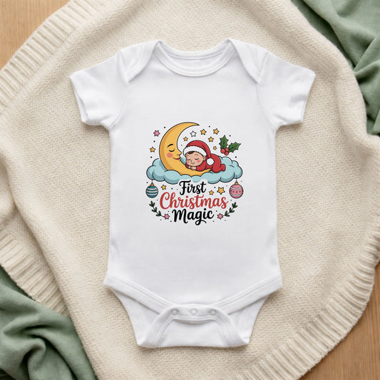 White baby onesie with Christmas-themed design on a textured surface