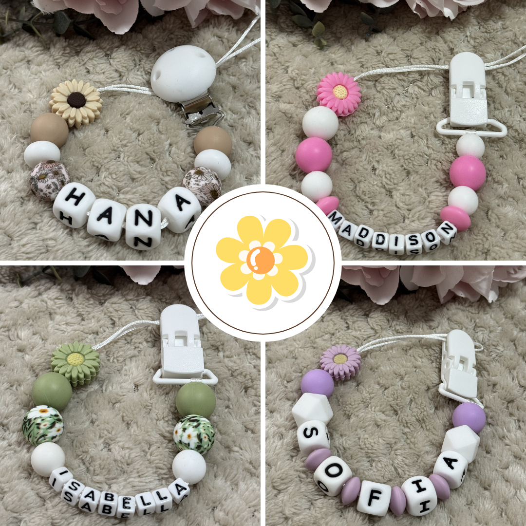 Collage of baby pacifier clips with name beads on a textured surface.