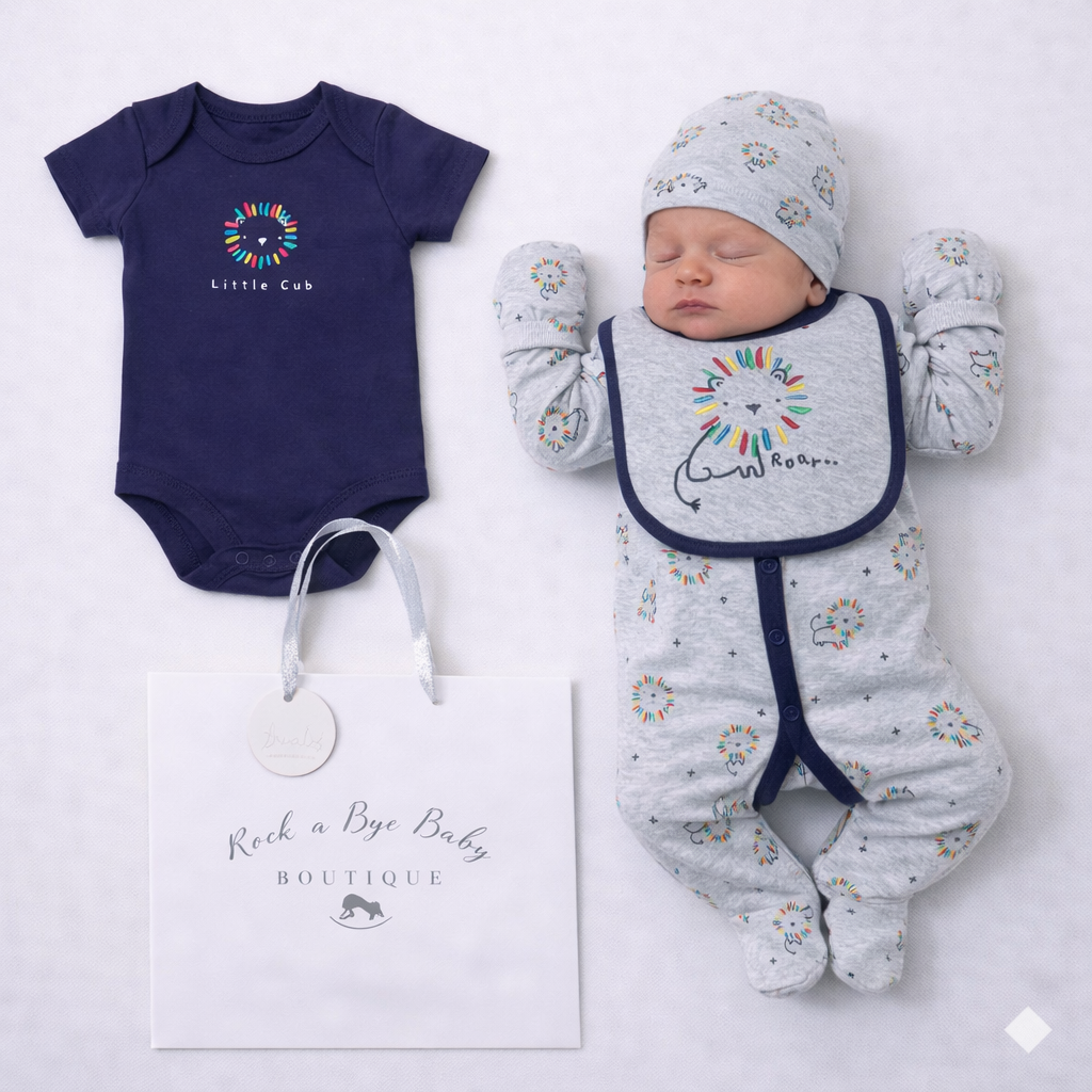 Baby outfit set with navy bodysuit, gray onesie, and bib on a white background.