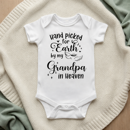 White baby onesie with text on a textured surface Handpicked for Earth by my Grandpa in Heaven Baby Bodysuit