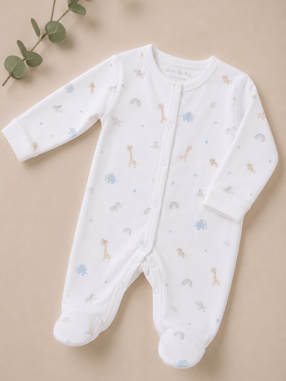 Baby onesie with animal prints on a beige background