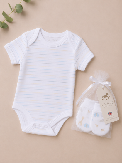 White baby bodysuit with blue stripes and white baby socks in a clear bag on a beige background.