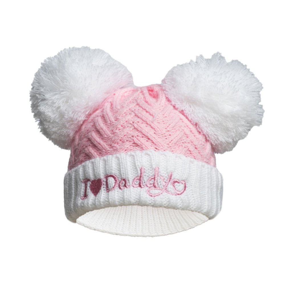 Pink and white beanie with double pom-poms and 'I ❤️ Daddy' text on a white background