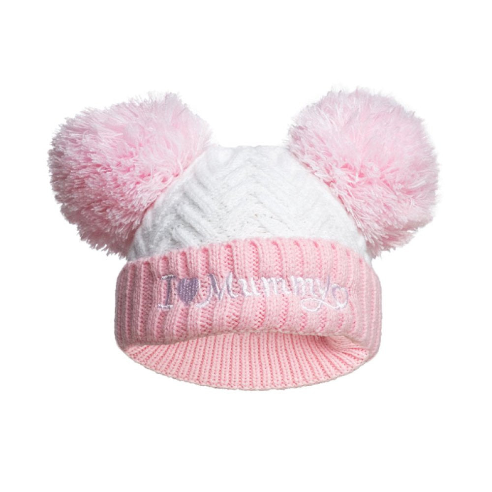 Pink and white knitted baby hat with pom-poms and 'I love Mummy' text on a white background