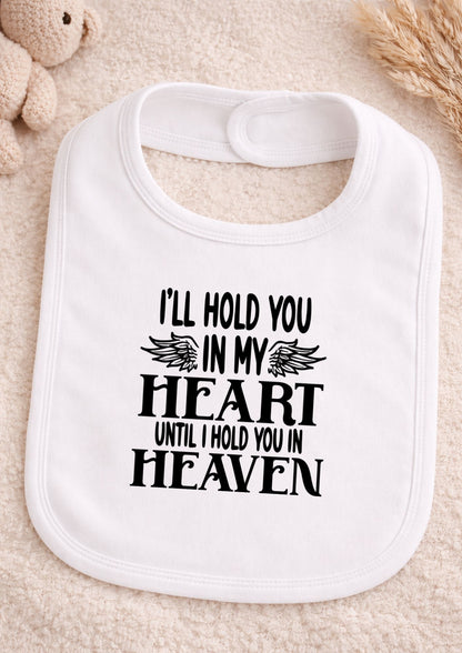 White bib with text on a beige background