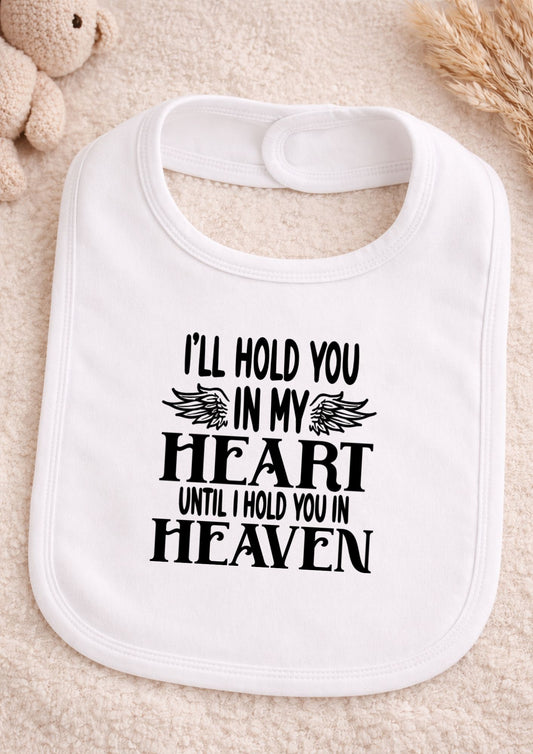 White bib with text on a beige background