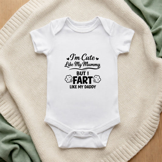 White baby onesie with humorous text on a textured surface I'm Cute Like My Mummy But I Fart Like My Daddy Baby Vest