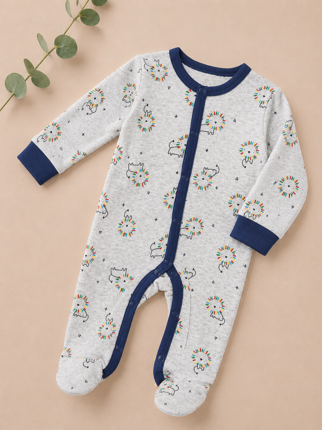 Baby onesie with Christmas-themed print on a beige background