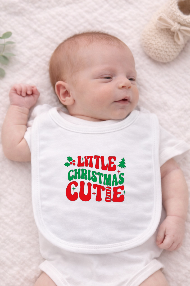 Celebrate the season in the cutest way with the Little Christmas Cutie Holiday Baby Bib. Featuring a festive design and soft, baby-friendly fabric, this bib is perfect for keeping little outfits clean during holiday meals, drool days, and cozy winter moments.