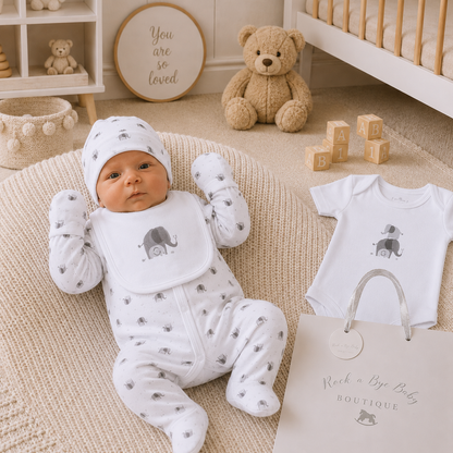 Little Elephant sleepsuit flatlay