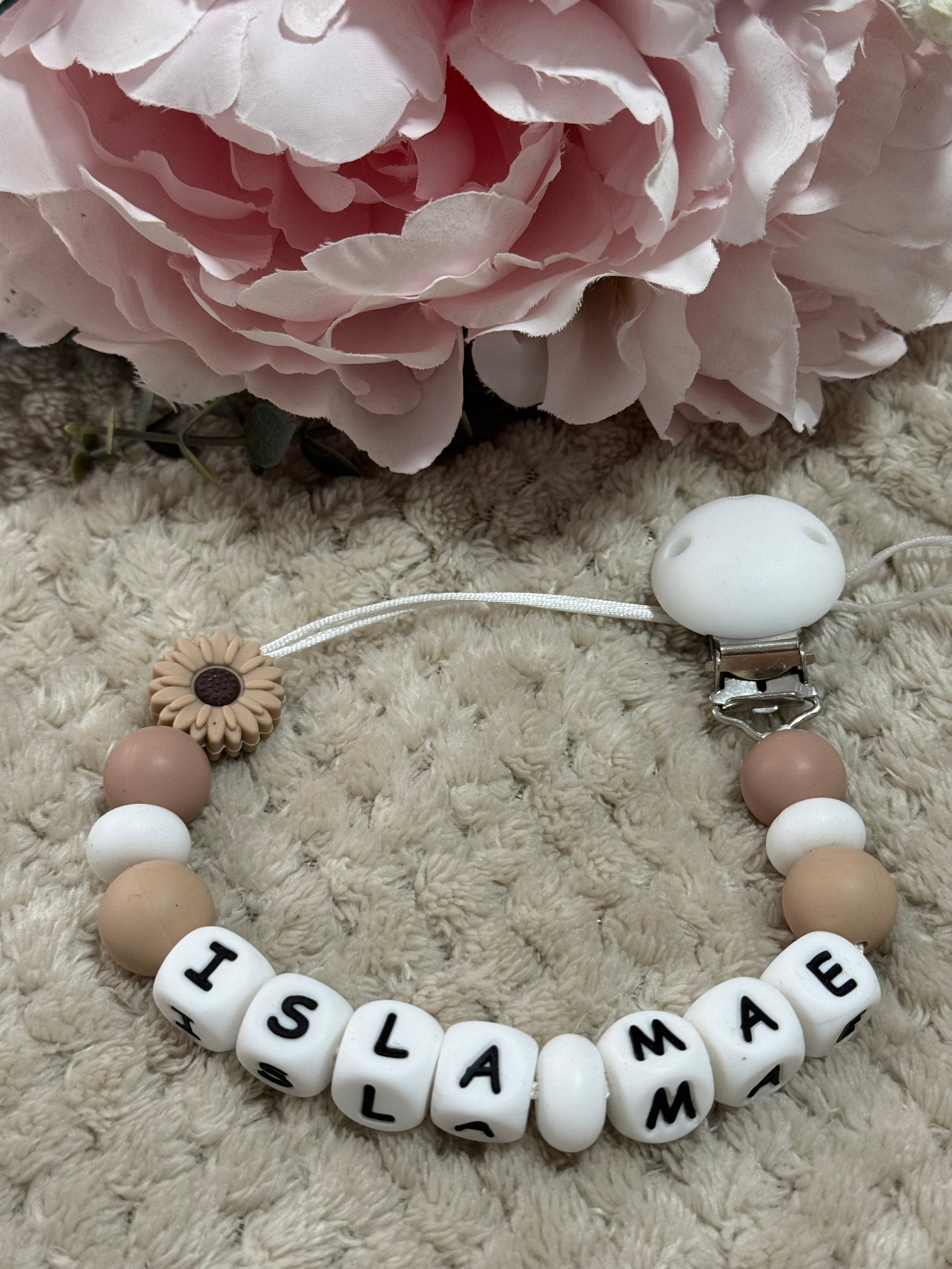 Cream, White and floral pattern beads on a dummy chain personalised with any name