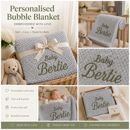 Personalized bubble blanket set in a soft light gray textured fabric with olive green embroidered text reading 'Baby Bertie' and a cream ribbon bow. The collage shows the blanket styled in a crib, wrapped in a basket, and in an open gift box, with a baby and teddy bear in the background.