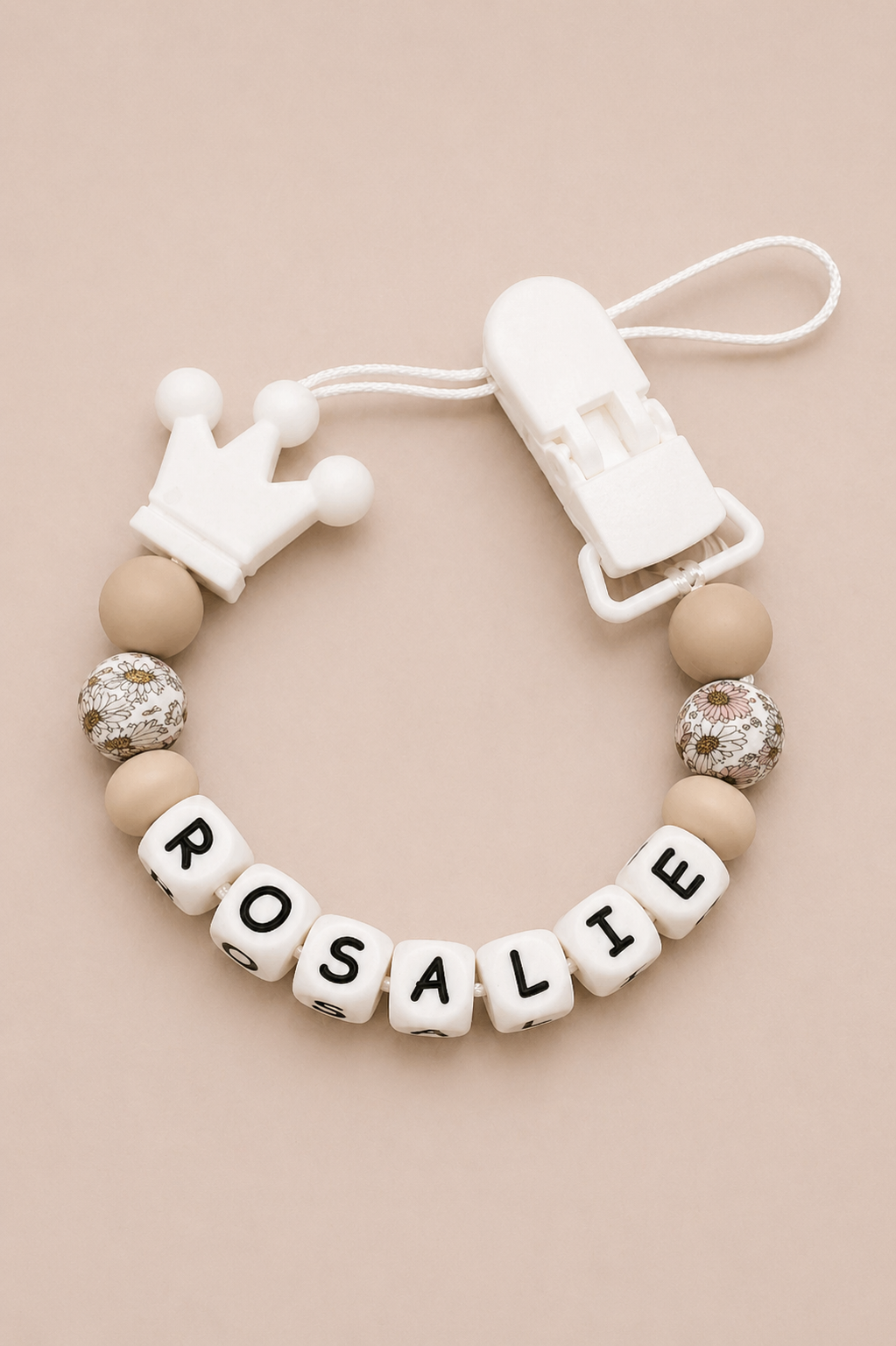 Baby teether with 'Rosalie' on a beige background