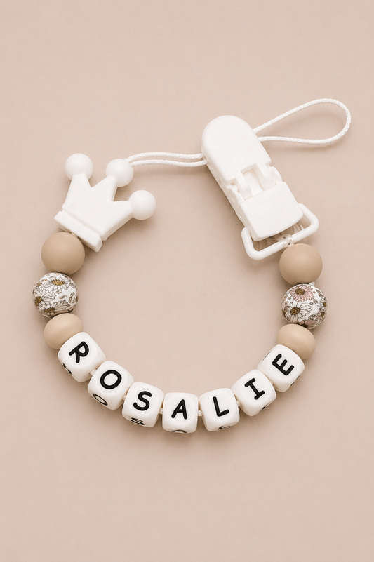 Baby teether with 'Rosalie' on a beige background
