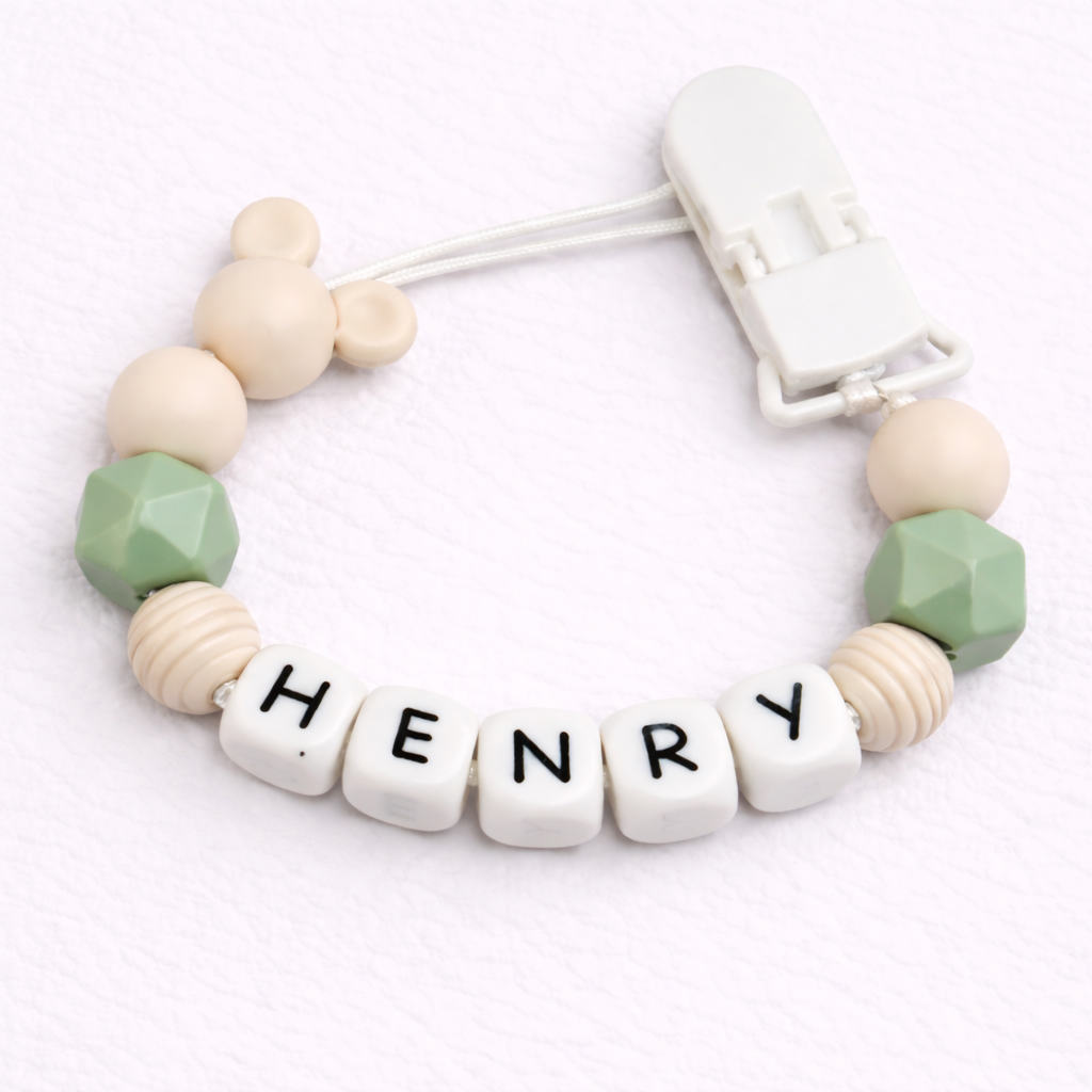 dummy clip with letter beads spelling 'HENRY' on a white background