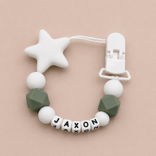 dummy clip with star and geometric beads on a beige background