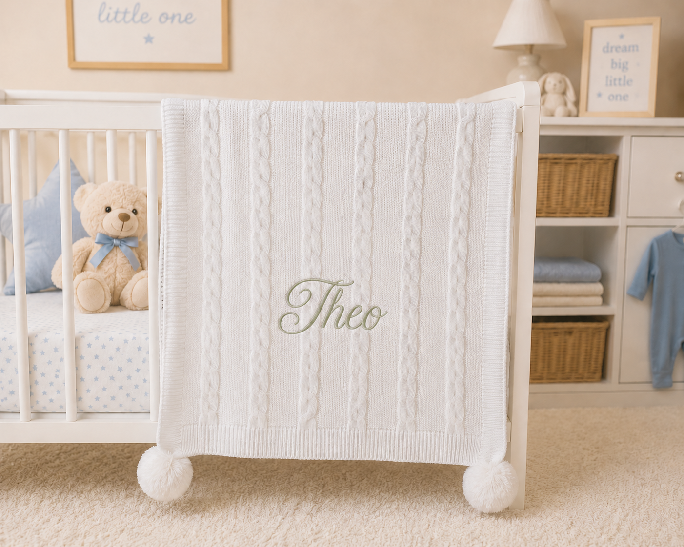 White crib with a textured blanket and teddy bear in a nursery setting