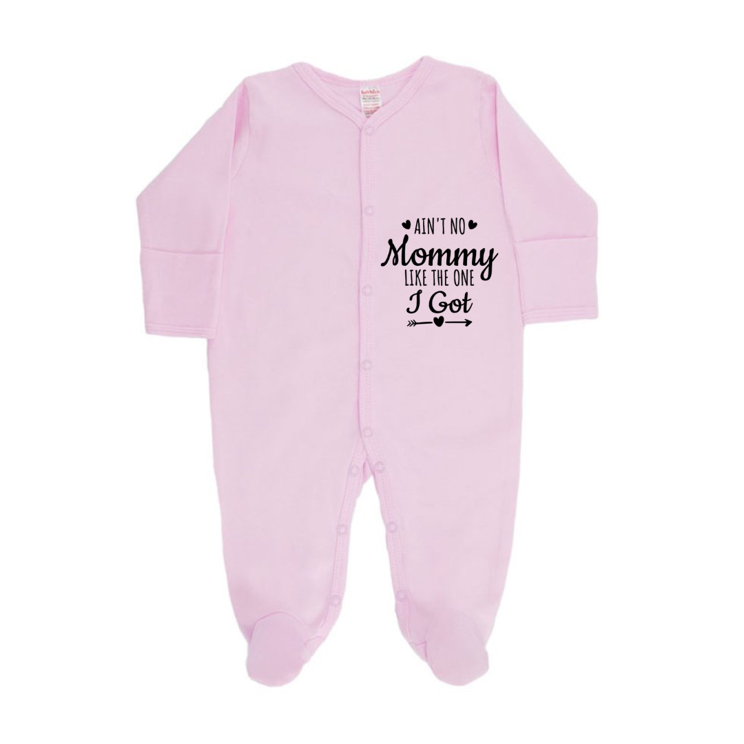 Pink baby onesie with text on a white background
