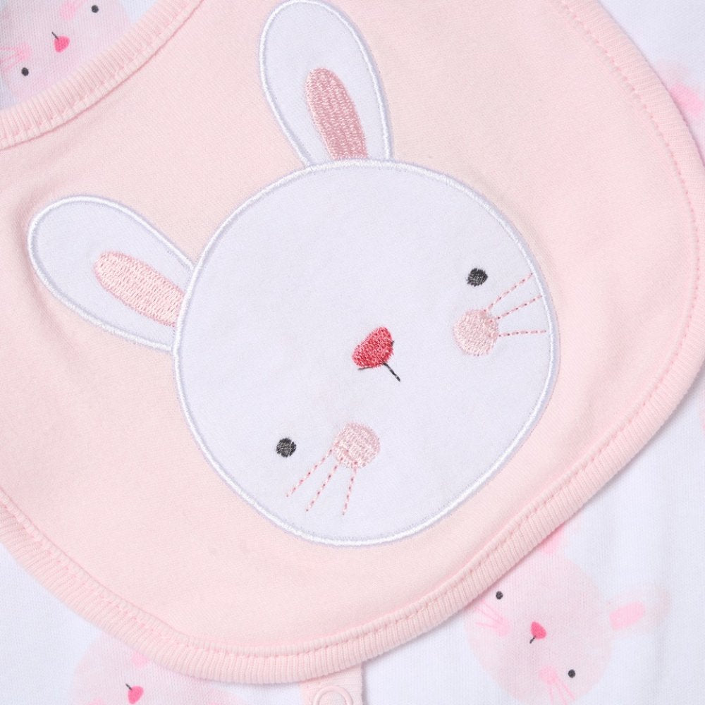 Pink baby bib with embroidered bunny face design on a light pink background
