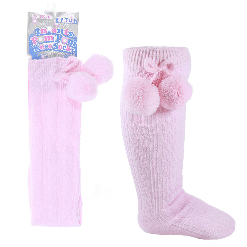 Pink knee-high socks with pom-poms and packaging on a white background