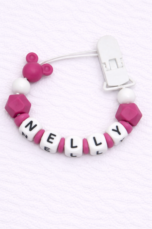 dummy clip with pink and white beads spelling 'NELLY' on a white background