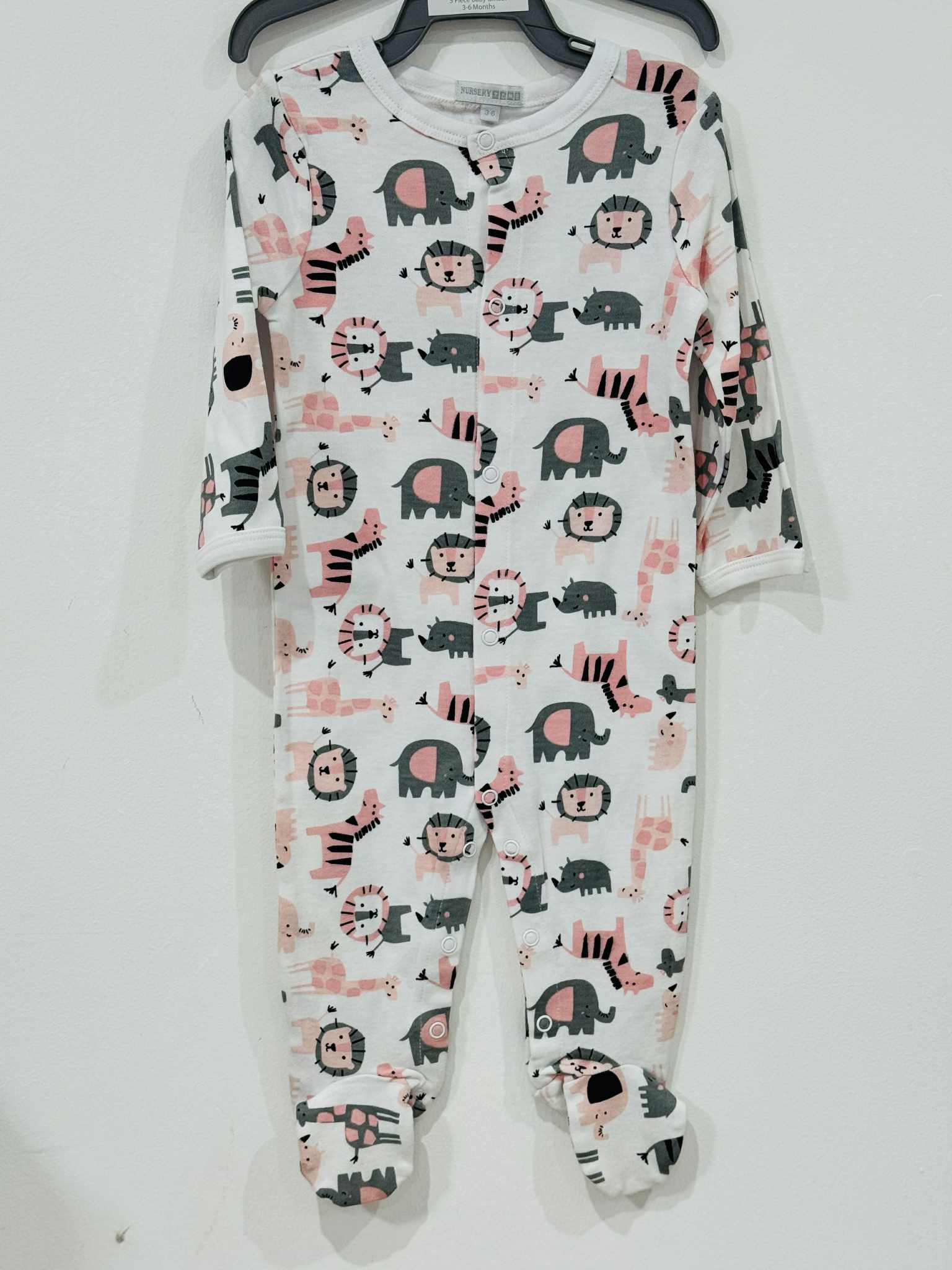 Baby onesie with animal pattern on a white background
