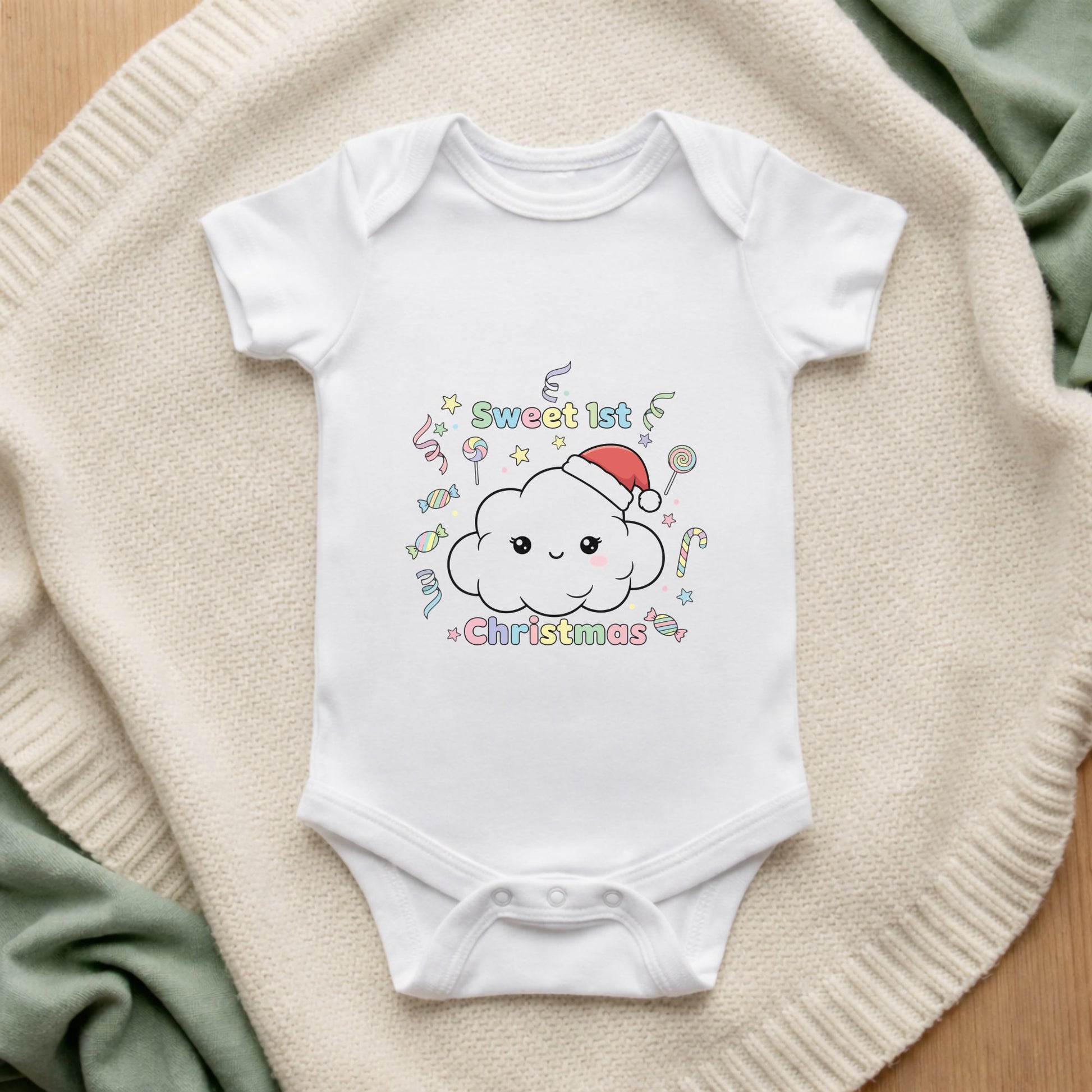 White baby onesie with a Christmas-themed design on a beige surface