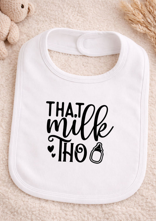 White baby bib with black text on a beige background