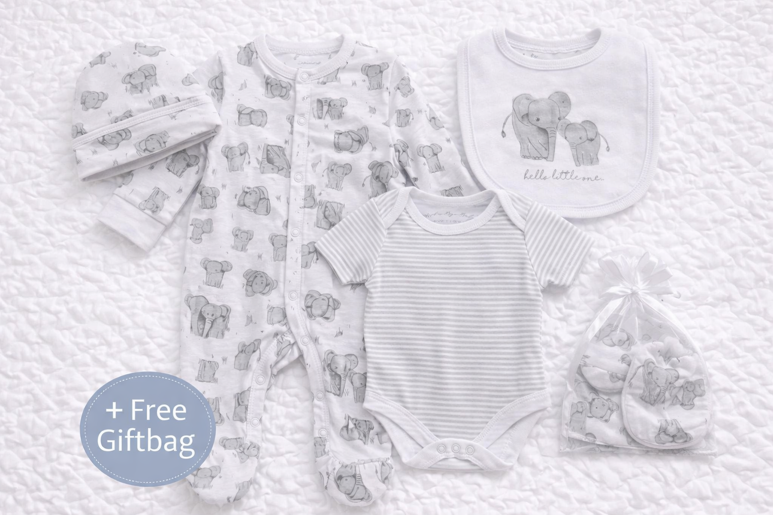 Unisex 5-piece baby clothing set with grey elephant print including footed babygrow, striped bodysuit, matching hat, mittens and elephant bib on white background