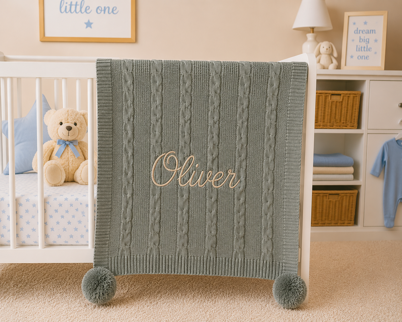 Green cable knit blanket with 'Oliver' embroidered on it in a nursery setting.