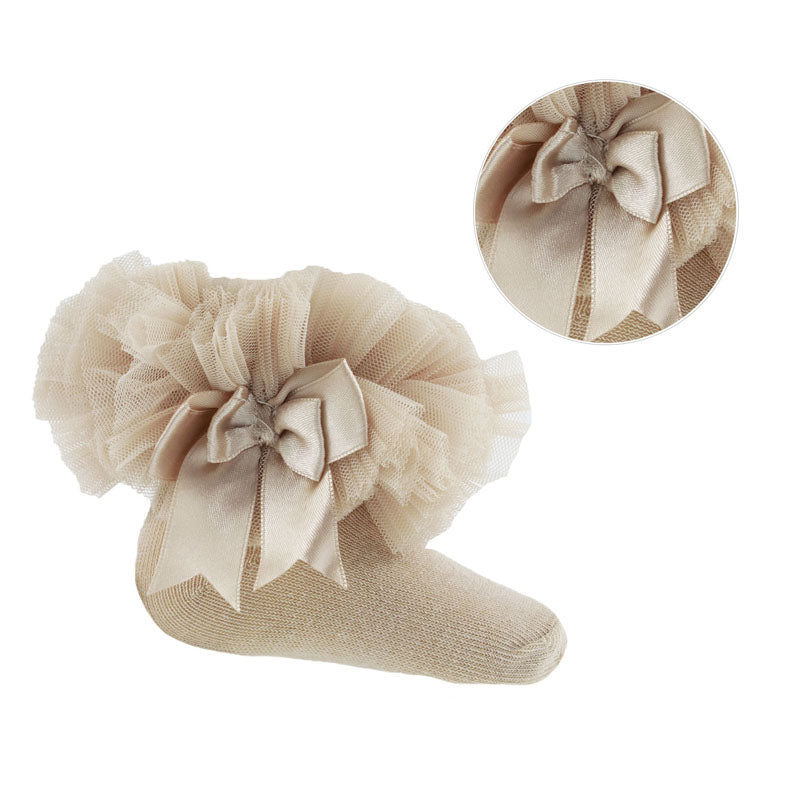 Beige tulle sock with bow detail on a white background