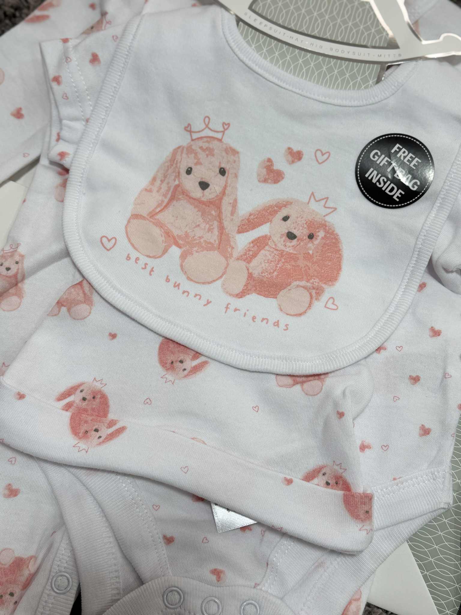 Adorable Baby Girls 5 Piece Layette gift set in Pink &amp; White with bunny prints. Set consists of sleepsuit, bodysuit, hat, bib and mittens and Giftbag. Made of 100% Cotton.