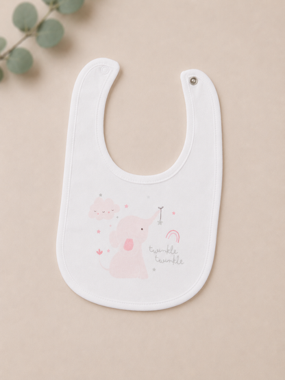 White baby bib with pink graphics on a beige background