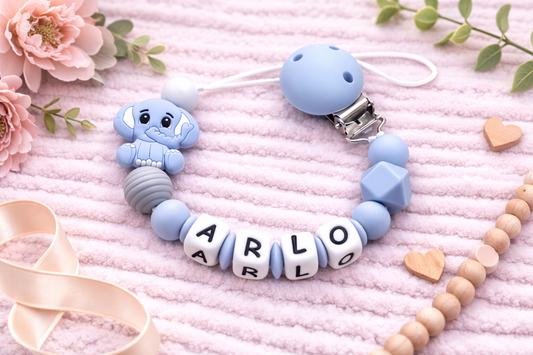 Premium blue elephant dummy clip with all-silicone letter beads. 100% food-grade silicone, custom name. Safe for teething babies. Perfect gift! 🐘