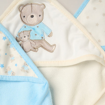 Baby blanket with teddy bear design on a light background