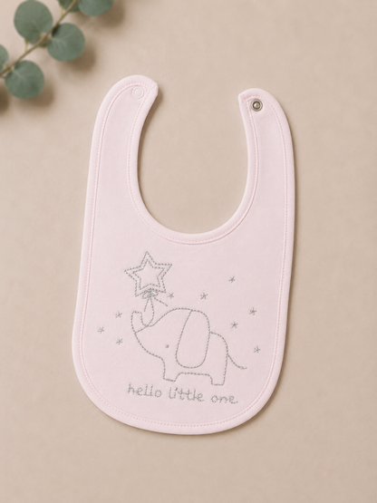 Baby bib with elephant design and text on a beige background