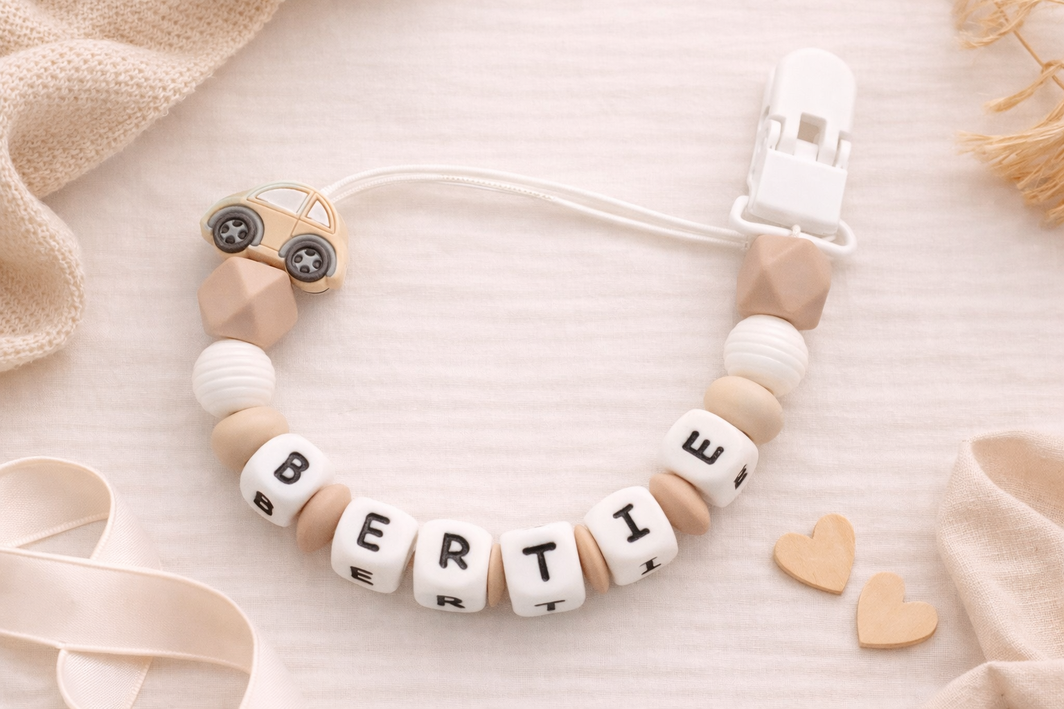 baby boys car dummy clip in cream and white with 'BERTIE' on a soft beige background