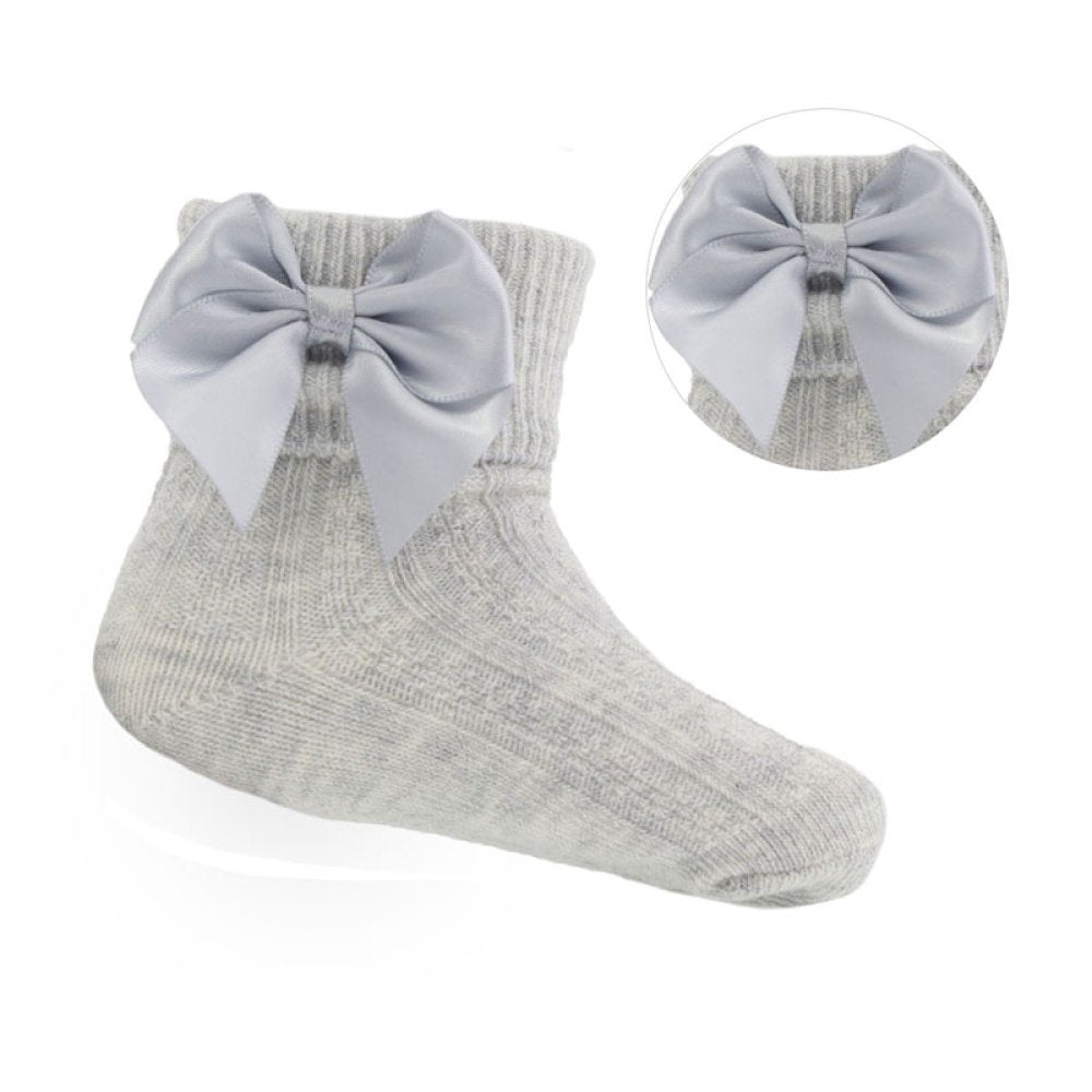 Gray sock with a large bow on a white background